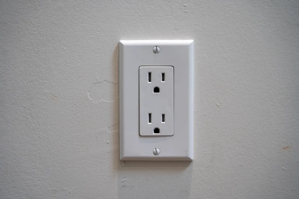 Wall outlet with an America-Canada style plug socket.